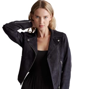 A woman is wearing a black suede biker jacket with asymmetrical zip closure and notched lapels.