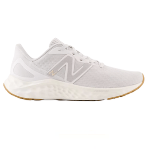 A white New Balance sneaker with a breathable mesh upper, featuring a beige \“N\“ logo, cushioned white sole, and beige gum outsole.