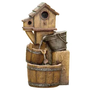 A decorative water fountain designed to resemble a rustic wooden birdhouse with a cascading bucket and barrel setup.