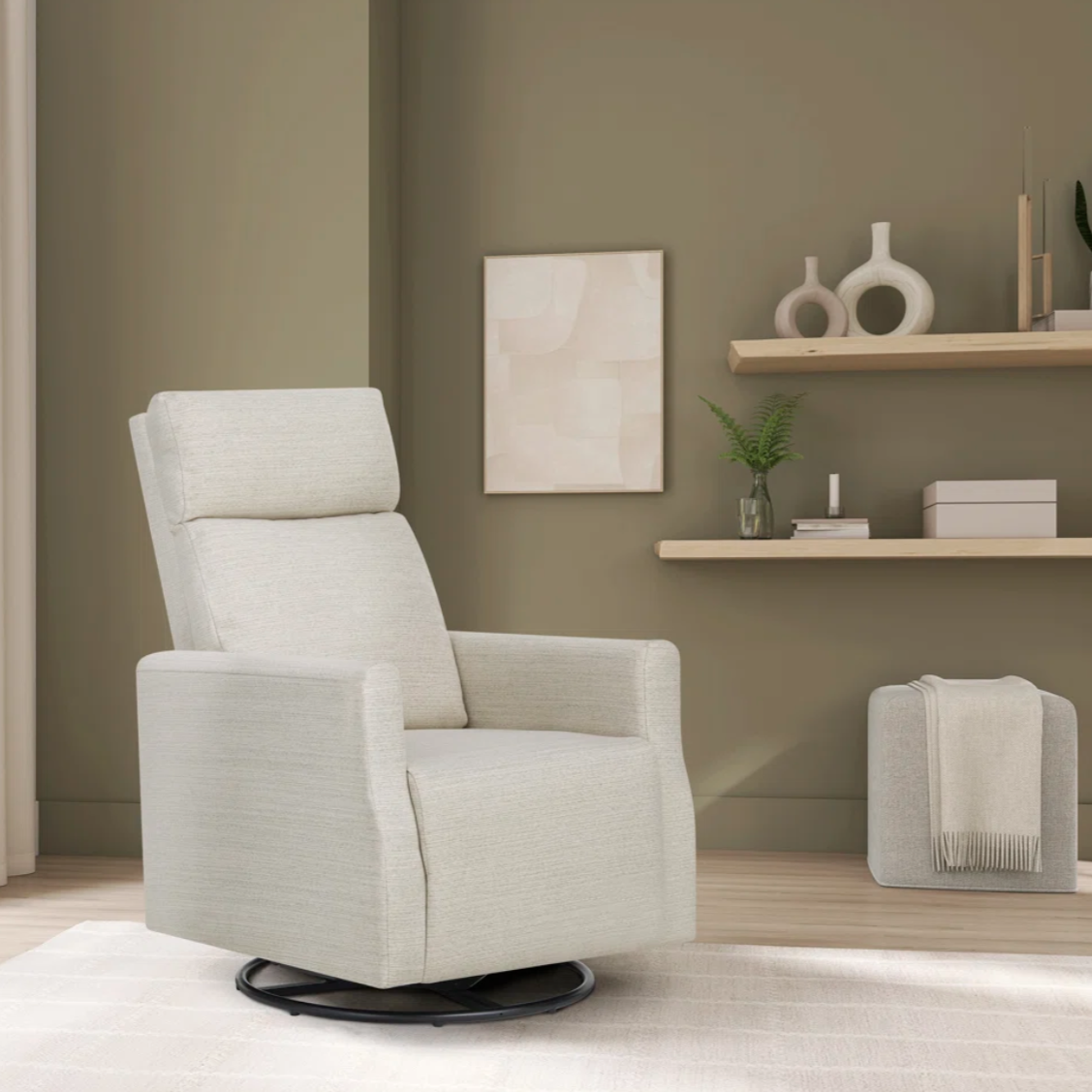 A light beige swivel recliner is set in a modern living room with a minimalist decor featuring shelves with decorative items and a small plant.