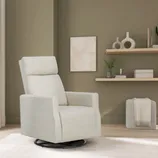 A light beige swivel recliner is set in a modern living room with a minimalist decor featuring shelves with decorative items and a small plant.