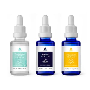 3pc Anti-Aging Serum Set includes Hyaluronic Acid Serum for hydration, Retinol Serum for firming, and Vitamin C Serum for brightening. Each comes in a 30 ml bottle with a dropper.