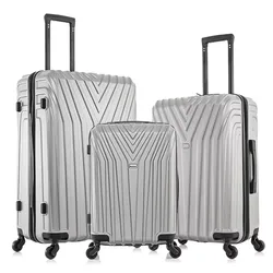 Three silver hard-shell suitcases with handles and four wheels each, featuring a V-shaped pattern design.