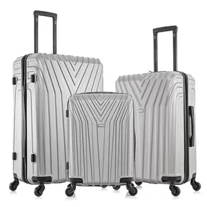 Three silver hard-shell suitcases with handles and four wheels each, featuring a V-shaped pattern design.