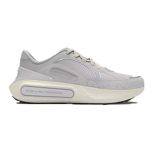 The UA Phantom 4 Luxe Shoes are light gray sneakers featuring a sleek design with perforated details and a prominent \“HOVR+\“ logo on the sole, offering a modern aesthetic suitable for athletic or casual wear.