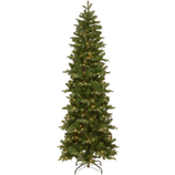 A tall, slender artificial Christmas tree with realistic green branches, pre-lit with warm white lights, and supported by a metal stand.