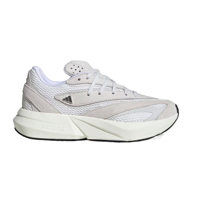 A white athletic shoe with mesh upper, suede accents, and a thick Lightstrike sole, featuring a minimal design and subtle branding.