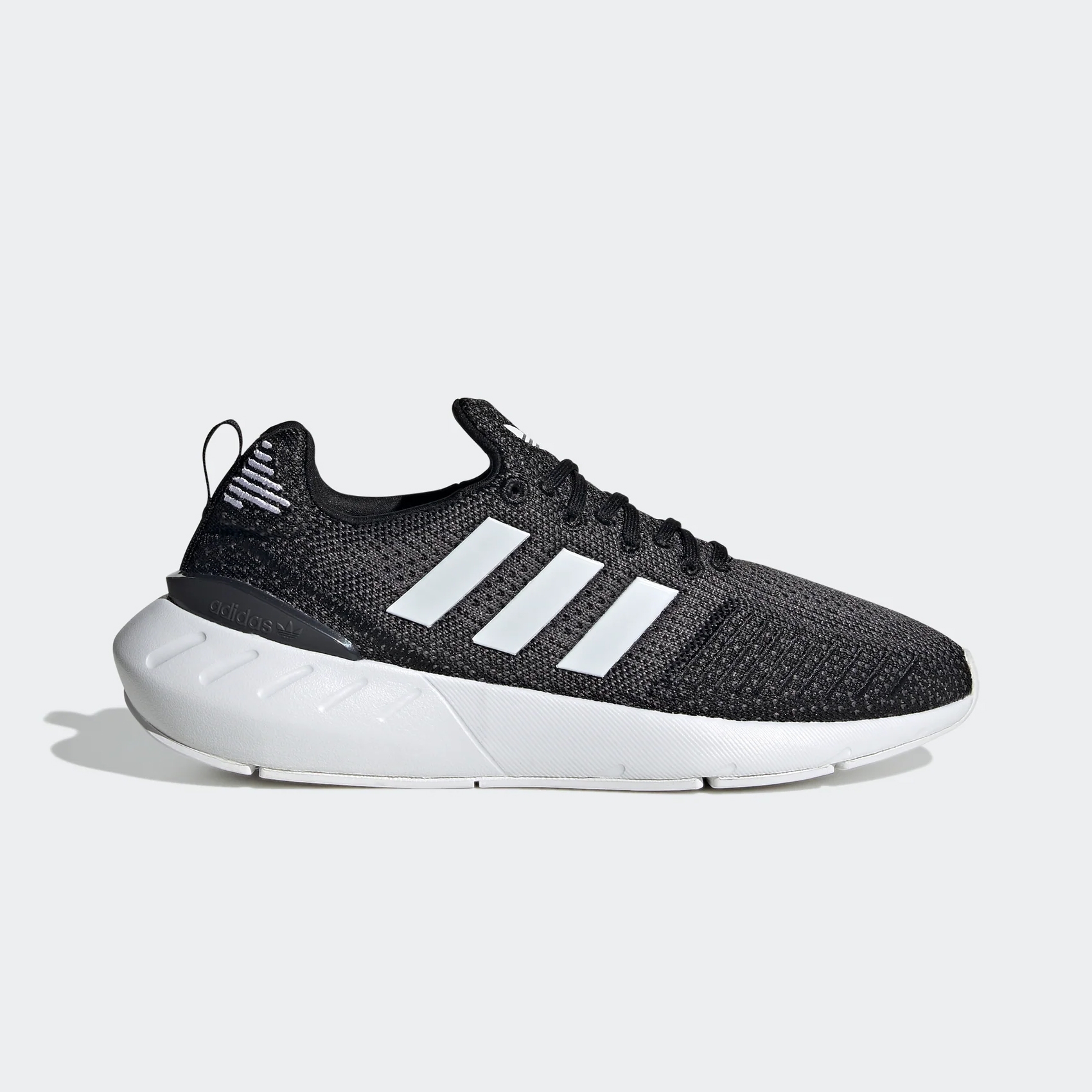 Black and white running shoes with three stripes on the side.