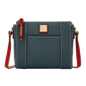 A blue leather crossbody bag with brown accents, featuring a front pocket and the Dooney & Bourke logo on a small square plaque.