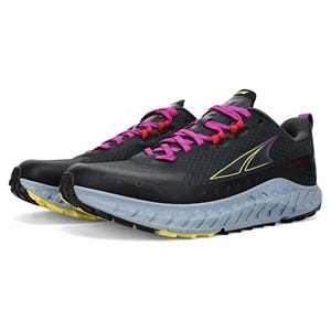 A pair of Altra Outroad women's shoes with a black upper, pink laces, a white midsole, and a yellow accent on the outsole.
