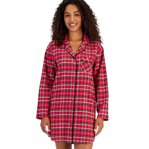 A woman wears a red plaid cotton flannel sleep shirt with long sleeves, a button-down front, and a single chest pocket.