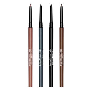 Four retractable BareMinerals eyeliners in varied shades: brown, gray, black, and medium brown. Each pencil has the brand logo and \“Mineralist Eyeliner\“ printed on the side.