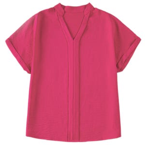 Bright pink lightweight blouse featuring short sleeves, a V-neckline, and a soft-textured fabric with a relaxed fit for casual wear.