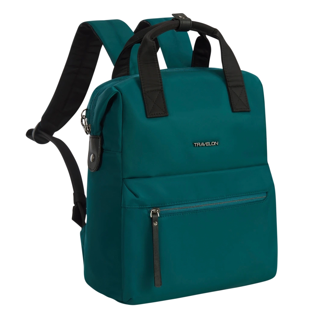 Teal backpack with black handles and logo \“Travelon,\“ featuring adjustable straps and a front zippered pocket.