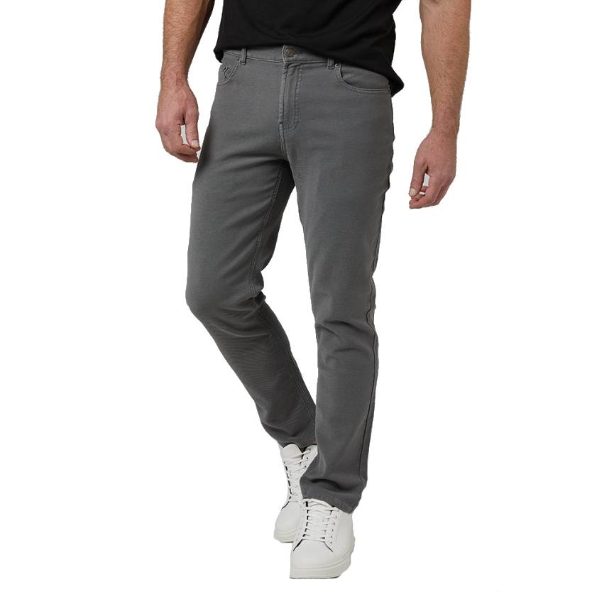 A person is wearing gray jeans paired with white sneakers and a black shirt.