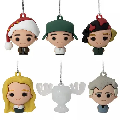 Holiday-themed keychains featuring cartoon-style characters with festive touches, including a Santa hat, and one shaped like a moose cup.