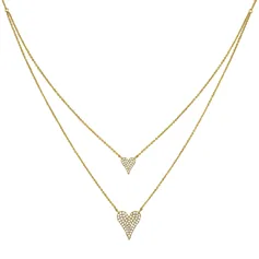 A gold-tone necklace featuring two heart-shaped pendants adorned with small, sparkling stones on a double-layer chain design.