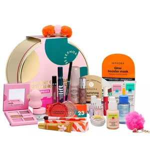 Sephora Advent Calendar featuring a variety of makeup and skincare items, including lip balm, mascara, glow booster mask, nail polish, eyeshadow palette, and bath bombs, all packaged in a round festive box.
