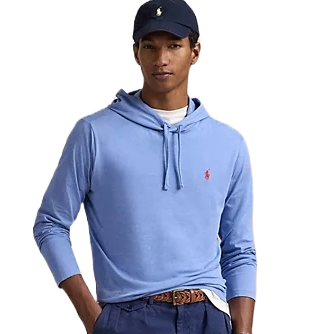 A light blue hooded tee with long sleeves and a drawstring hood, featuring the Polo Ralph Lauren logo in red on the chest. Worn with a white undershirt, a navy cap, blue pants, and a brown belt.