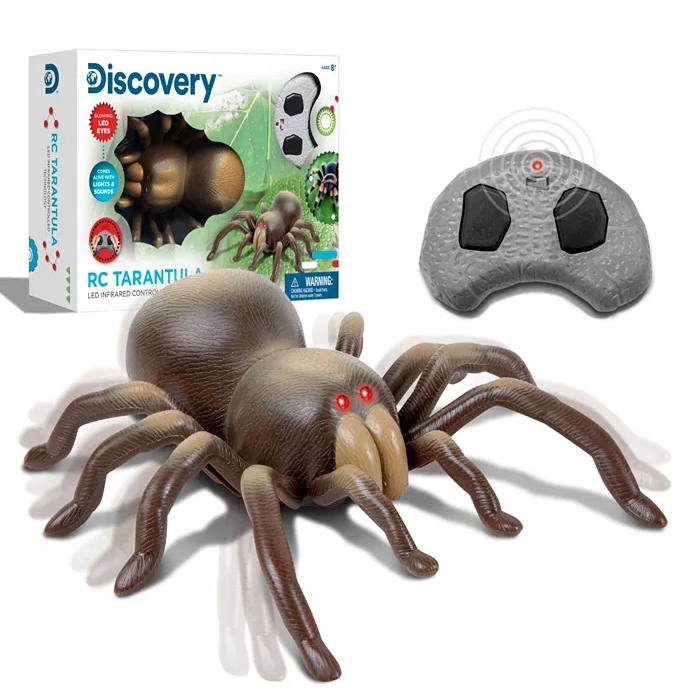 Remote-controlled tarantula toy with LED eyes, packaged with a gray two-button infrared controller.
