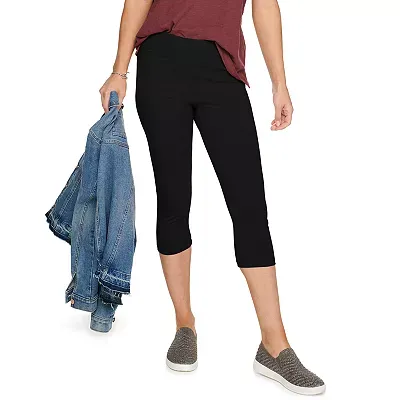 Black Sonoma capri leggings with a mid-calf length cut, worn with casual sneakers and a maroon top.