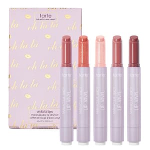 Tarte Oh Là Là Lips Maracuja Juicy Lip Vinyl Set features five lip vinyl colors, packaged in a pastel purple box with gold accents.