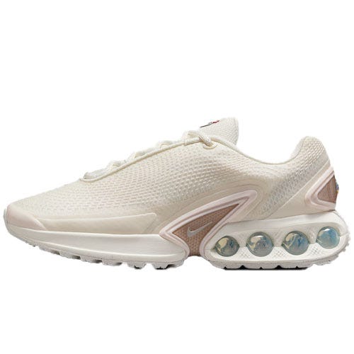 A white athletic shoe with a textured upper and visible cushioning in the midsole. It features a series of spherical pods for support and comfort, with a minimalist design.