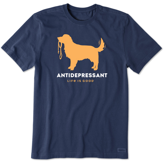 Navy blue T-shirt featuring an orange silhouette of a dog holding a leash, with the words \“ANTIDEPRESSANT\“ and \“LIFE IS GOOD\“ printed below.
