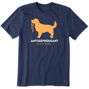 Navy blue T-shirt featuring an orange silhouette of a dog holding a leash, with the words \“ANTIDEPRESSANT\“ and \“LIFE IS GOOD\“ printed below.