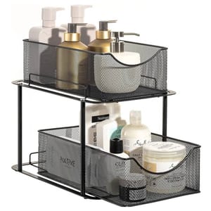 The Sorbus 2-Tier Basket Organizer features black metal mesh baskets, ideal for storing bathroom essentials like soap dispensers and bottles of lotion and shampoo. The upper and lower baskets are stacked to efficiently utilize space.