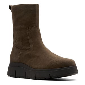 A brown suede mid-calf boot with a chunky black sole and a pull-on design.