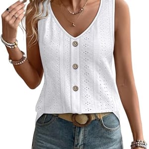 Sleeveless white crochet top with button details, paired with denim shorts.