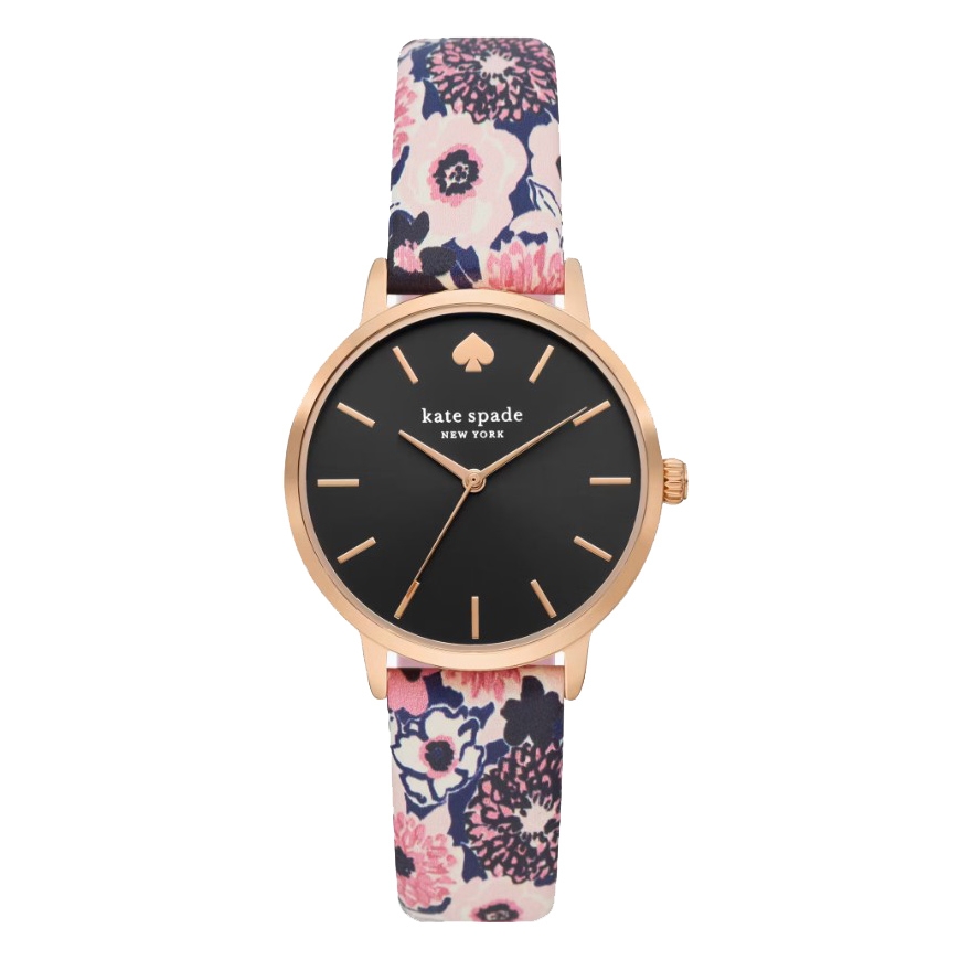 A Kate Spade Floral Metro Watch with a black dial, gold-tone case, and a floral-patterned strap in shades of pink, black, and white.