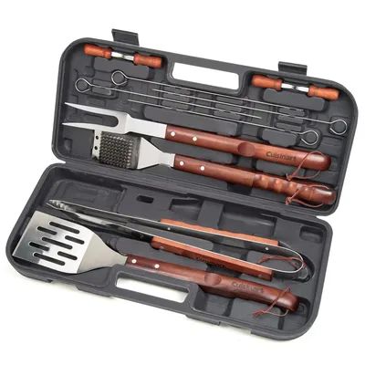 A barbecue tool set in a carrying case features skewers, a meat fork, a grill brush, tongs, and a spatula, all with wooden handles.
