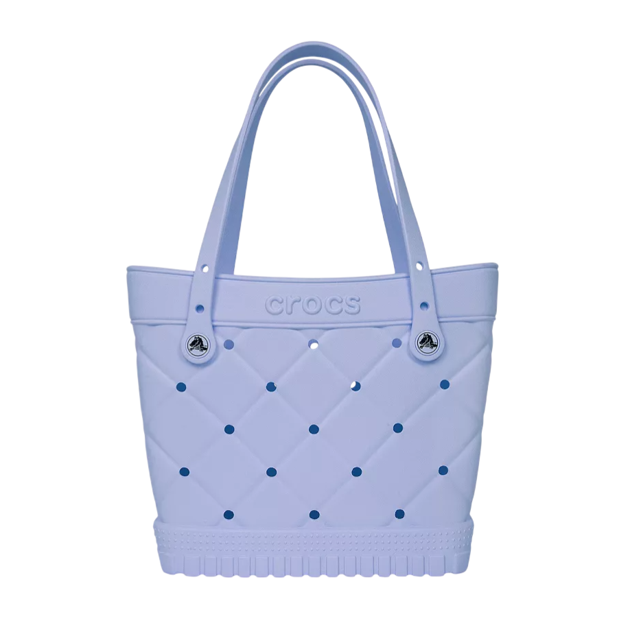 A light purple Crocs tote bag featuring a quilted pattern with perforations and two sturdy handles.