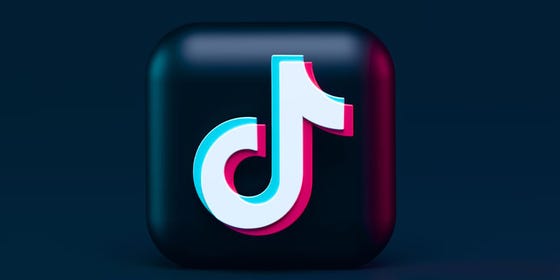 The logo for the social media platform TikTok on a dark blue background.