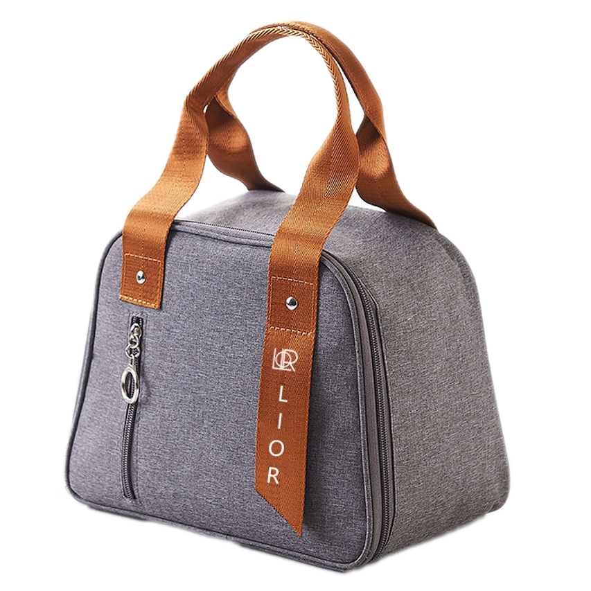 A gray insulated canvas lunch bag with brown handles and a zippered front pocket, featuring the text \“LIOR\“ on the handle.