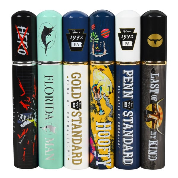 Six decorative cigar tubes with various colorful and artistic designs, each labeled with different names like \“Florida Man,\“ \“Gold Standard,\“ and \“Penn Standard.\“
