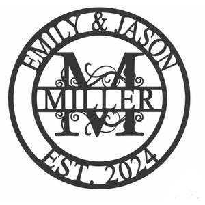 Round black steel sign with the names \“Emily & Jason,\“ large letter \“M,\“ \“Miller\“ across the middle, and \“Est. 2024\“ at the bottom, all surrounded by decorative swirls.
