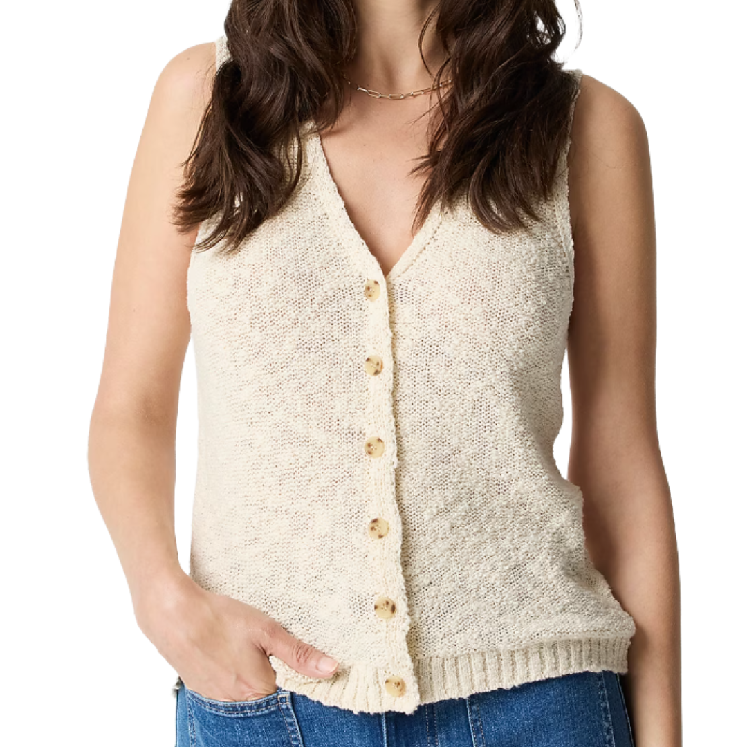 A sleeveless, cream-colored button-up knit vest paired with blue jeans.