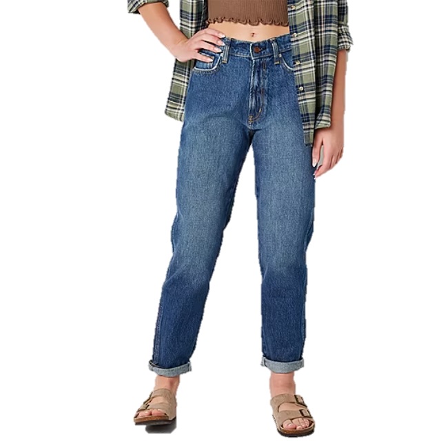 A person is wearing blue jeans with a flannel shirt and brown sandals.