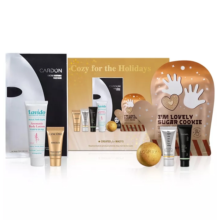 The 7-Pc Cozy For The Holidays Skincare Set includes a Cardon Cactus Soothing Face Mask, Lavido Aromatic Body Lotion, Lancôme Absolue Cream, a sugar cookie hand mask, and additional skincare items from brands like Lovery, Prevage, and Butta.
