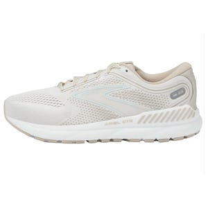 A single beige Brooks Ariel running shoe with breathable mesh and sturdy sole design.