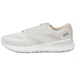 A single beige Brooks Ariel running shoe with breathable mesh and sturdy sole design.