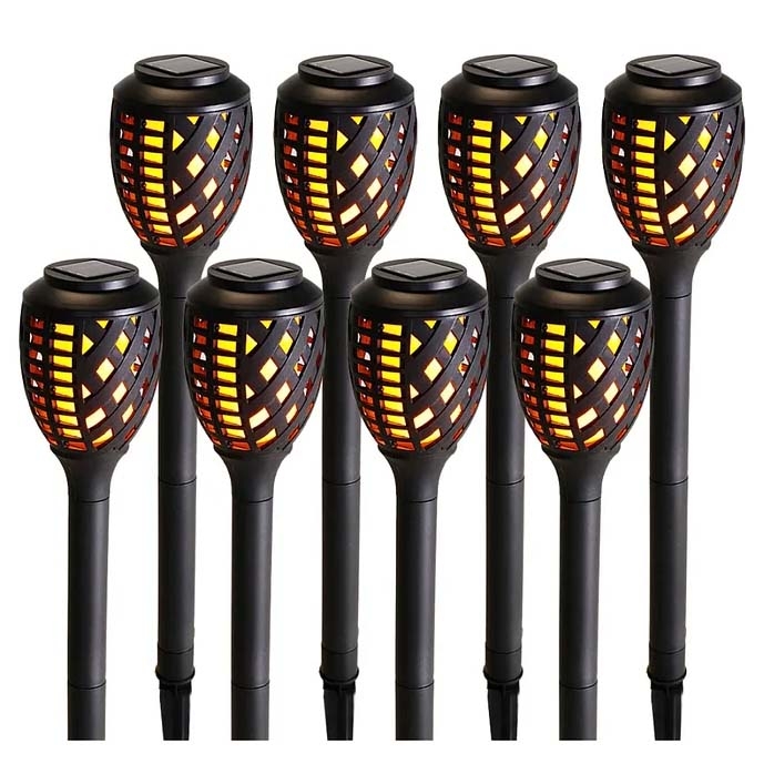 8-piece set of black solar-powered yard lights with a basket weave design, featuring warm LED lights that mimic flickering flames.