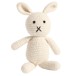 A crocheted stuffed rabbit with elongated ears, featuring simple black embroidered eyes and a cross-stitched mouth.