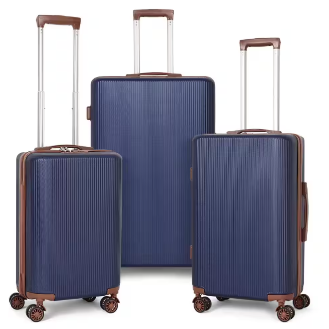 A 3-piece nested hardside luggage set in navy blue with brown accents features retractable handles, four spinner wheels per suitcase, and ribbed exteriors for durability. Sizes vary for versatile travel needs.