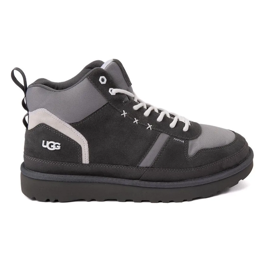 A pair of UGG brand high-top sneakers with grey and black panels, white laces, and a thick black sole.