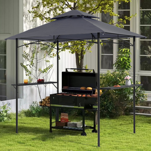 A steel grill gazebo with a dark canopy provides shade and cover for an outdoor grill setup. It features side shelves for additional space, has a black frame, and is positioned in a garden setting beside a house.