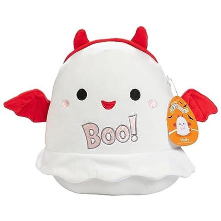 A plush toy of a white ghost with red devil horns and wings, embroidered with the word \“Boo!\“